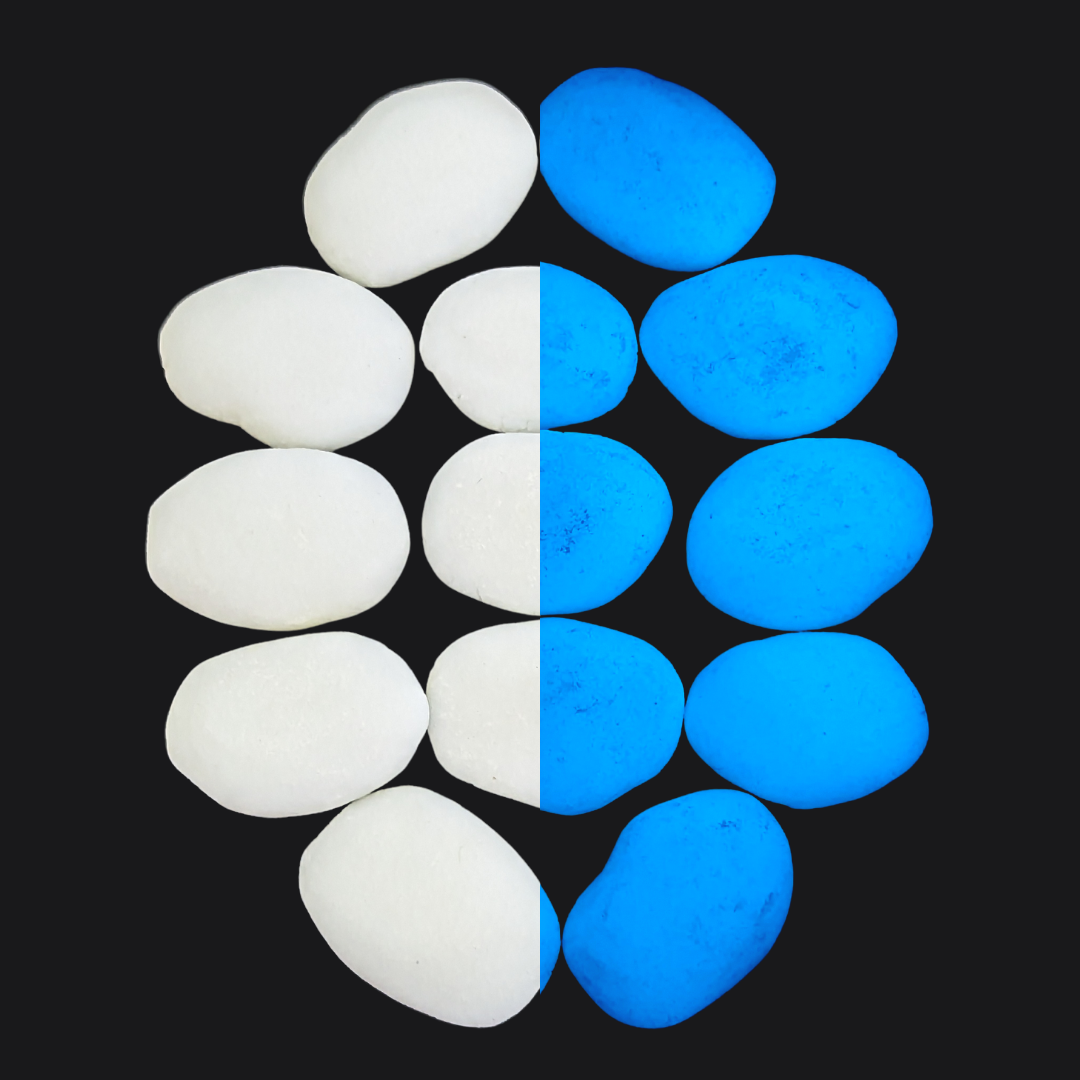 Close-up of It Glows glow-in-the-dark stones, emitting a soft blue light.